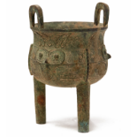 A BRONZE 'TAOTIE' TRIPOD CENSER, DING