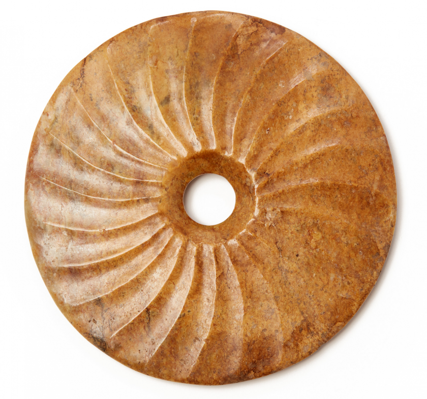 A SPIRALLY FLUTED CARVED JADE BI DISK