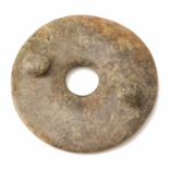 A CARVED JADE BI DISC