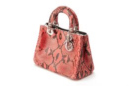 A CHRISTIAN DIOR PINK & BLACK SNAKE SKIN BAG