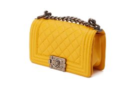 A CHANEL YELLOW LEATHER QUILTED SMALL BOY FLAP