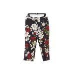 A PAIR OF BLACK DOLCE & GABBANA ROSE PATTERNED TROUSERS