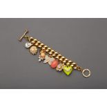 A JUICY COUTURE GOLD TONE CHARM BRACELET