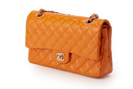 A CHANEL ORANGE PATENT LEATHER MEDIUM DOUBLE FLAP