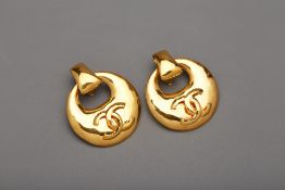 A PAIR OF CHANEL GOLD TONE CC MEDALLION CLIP ON EARRINGS