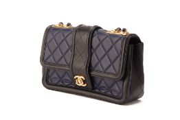 A CHANEL NAVY & BLACK LEATHER MEDIUM FLAP