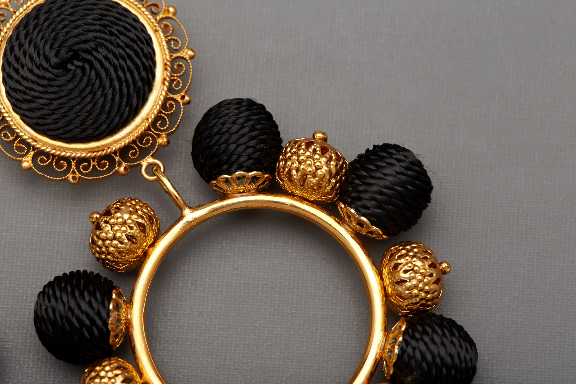 A PAIR OF DOLCE & GABBANA BLACK AND GOLD CLIP ON EARRINGS - Image 2 of 2