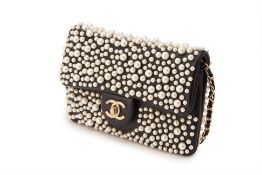 A CHANEL BLACK LEATHER W.O.C WITH PEARL EMBELLISHMENT PURSE