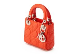 A CHRISTIAN DIOR ORANGE QUILTED MICRO LADY DIOR