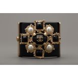 A CHANEL CC PEARL STUDDED BLACK CUFF