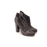 A PAIR OF NINE WEST SEQUINNED ANKLE BOOTS US 8