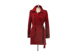 A BURBERRY DARK RED MID LENGTH TRENCH COAT