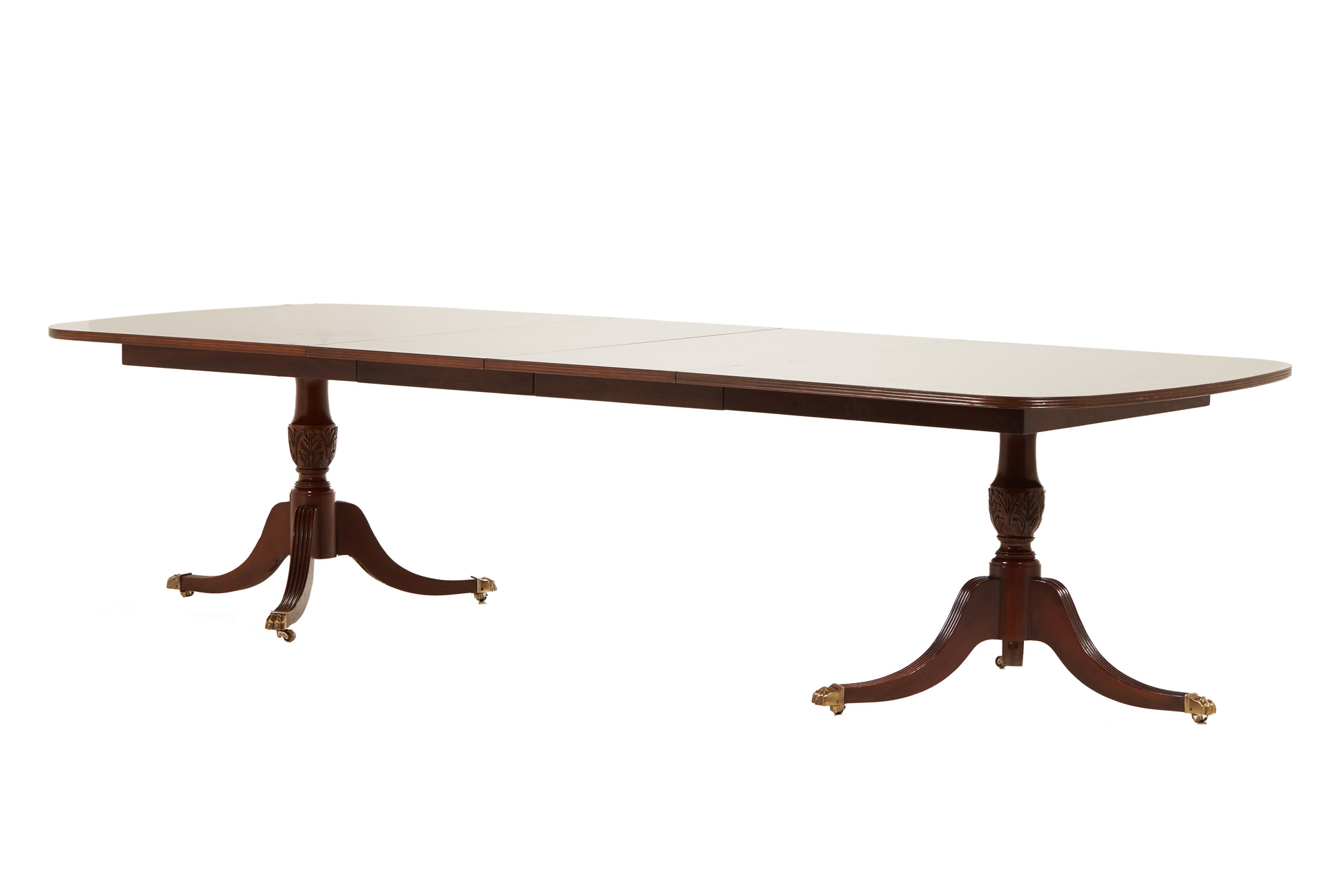 A GEORGE III STYLE TWIN PILLAR EXTENDING DINING TABLE