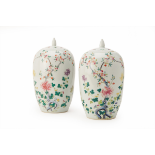 A PAIR OF FAMILLE ROSE PORCELAIN JARS AND COVERS