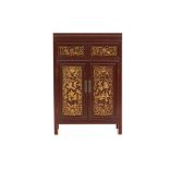 A PERANAKAN STYLE CARVED AND GILT SIDE CABINET