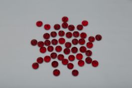 A GROUP OF SWAROVSKI RED CRYSTALS RUBYS
