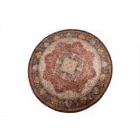 A LARGE SILK PERSIAN STYLE CIRCULAR CARPET