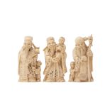 A SET OF THREE CARVED IVORY FU LU SHOU FIGURES