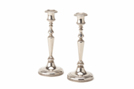 A PAIR OF SILVER PLATED CANDLESTICKS