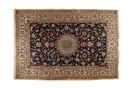 A LARGE PERSIAN DESIGN CARPET