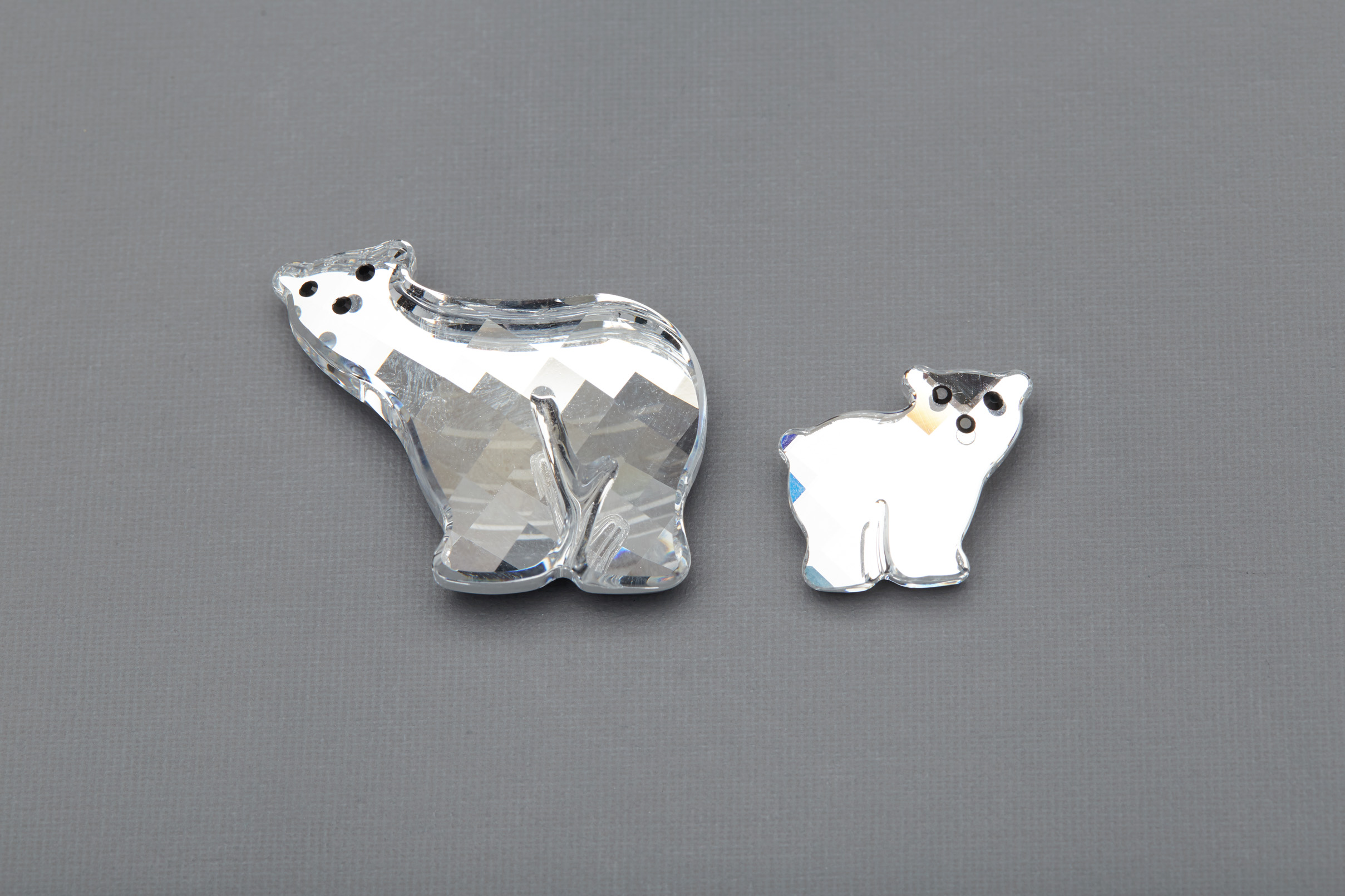 A SWAROVSKI POLAR BEAR AND CUB