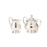 A SILVER PLATED MILK JUG AND SUGAR BOWL