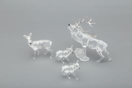 FOUR SWAROVSKI DEER FIGURINES