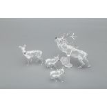 FOUR SWAROVSKI DEER FIGURINES