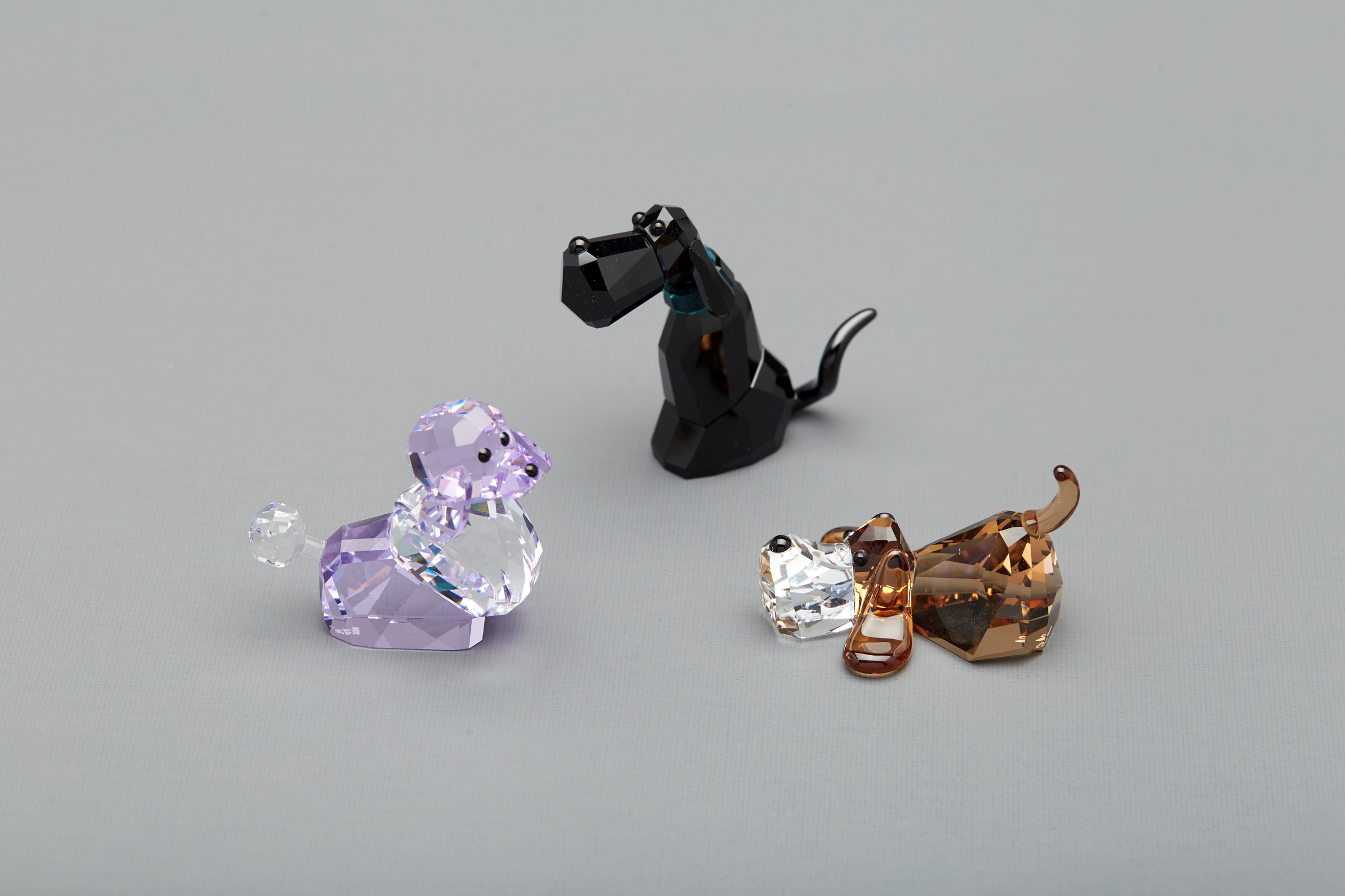 THREE SWAROVSKI 'GANG OF DOG' FIGURINES