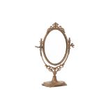 AN OVAL GILT METAL SWING DRESSING TABLE MIRROR
