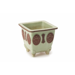 A SQUARE CELADON GLAZED PORCELAIN JARDINIERE