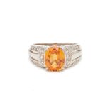 A MANDARIN GARNET AND DIAMOND RING