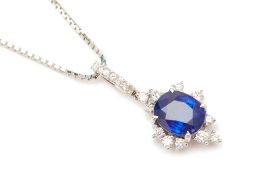 A PLATINIUM BLUE SAPPHIRE AND DIAMOND PENDANT ON CHAIN