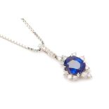 A PLATINIUM BLUE SAPPHIRE AND DIAMOND PENDANT ON CHAIN