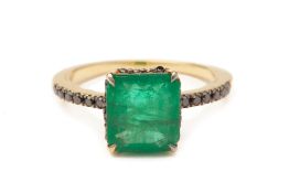 AN EMERALD AND BLACK DIAMOND RING