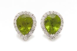 A PAIR OF PERIDOT AND DIAMOND CLUSTER STUD EARRINGS