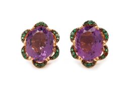 A PAIR OF AMETHYST AND EMERALD STUD EARRINGS