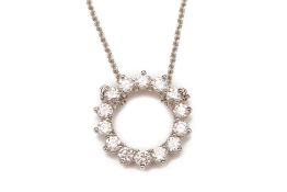 A TIFFANY & CO. PLATINUM & DIAMOND CIRCLE PENDANT AND CHAIN