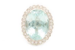 A LARGE AQUAMARINE AND DIAMOND CLUSTER RING