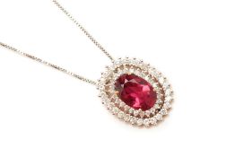 A RUBELLITE AND DIAMOND CLUSTER PENDANT ON CHAIN