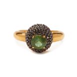 A GREEN TOURMALINE AND BLACK SAPPHIRE RING