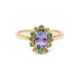 A TANZANITE AND EMERALD CLUSTER RING