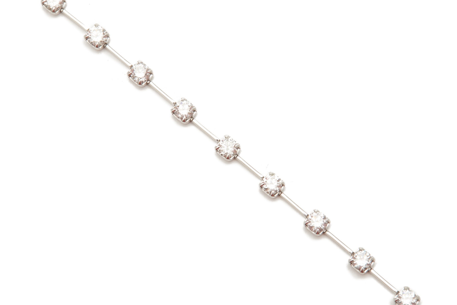 A PLATINUM AND DIAMOND TENNIS BRACELET