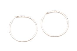 A PAIR OF DIAMOND HOOP EARRINGS