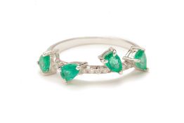 AN EMERALD AND DIAMOND RING