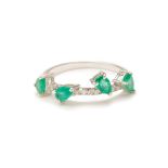 AN EMERALD AND DIAMOND RING