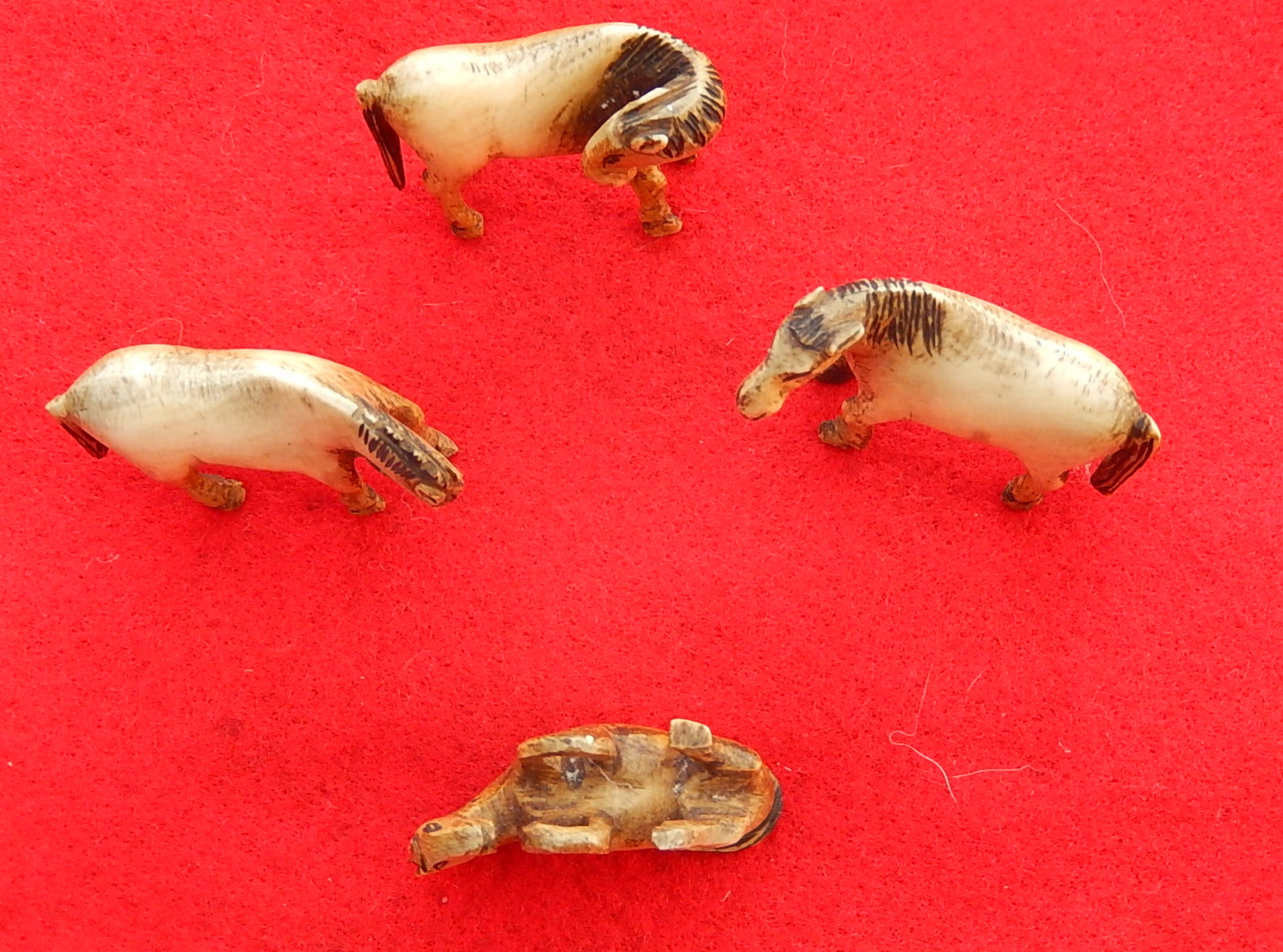 Vintage Set of 4 equine figures in bone. Standing examples approx. 2 ins x 1.3 ins.  The cost of