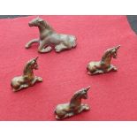 3 small unicorns in lying pose, approx. 1.6 ins sq. In brass.