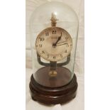 Bulle 800 Day Electromagnetic Clock on wooden base with glass dome. Stands 10.5" tall overall.