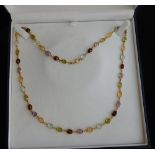 18ct gold necklace with 43 semi-precious stones of 5 different types in a repeating pattern.